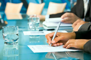 Hands_writin_boardroom.jpg