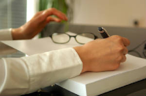 Hands_writing_report_interrogatories.jpg